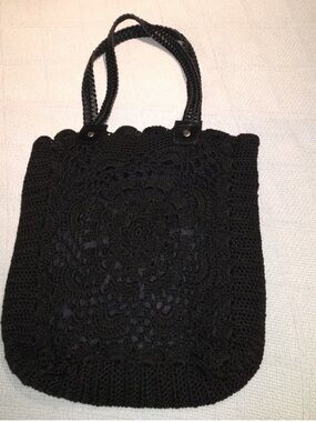 Black woven handbag